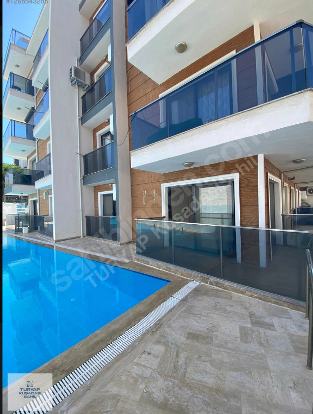 Kuşadası Davutlarda havuzlu sitede satılık 2+1 daire